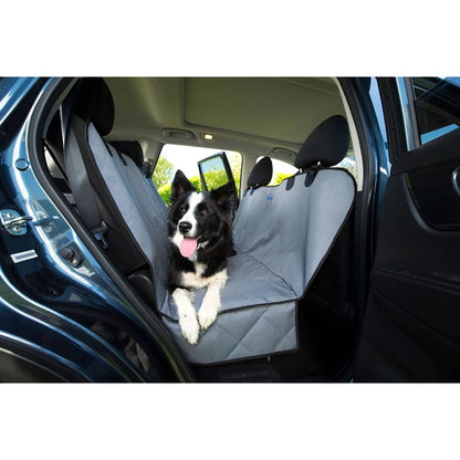 dog sitting in a car on the henry wag car bench hammock